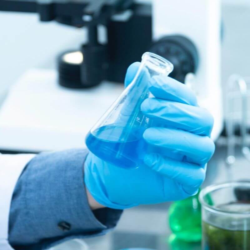 A Person Holding a Beaker in Lab